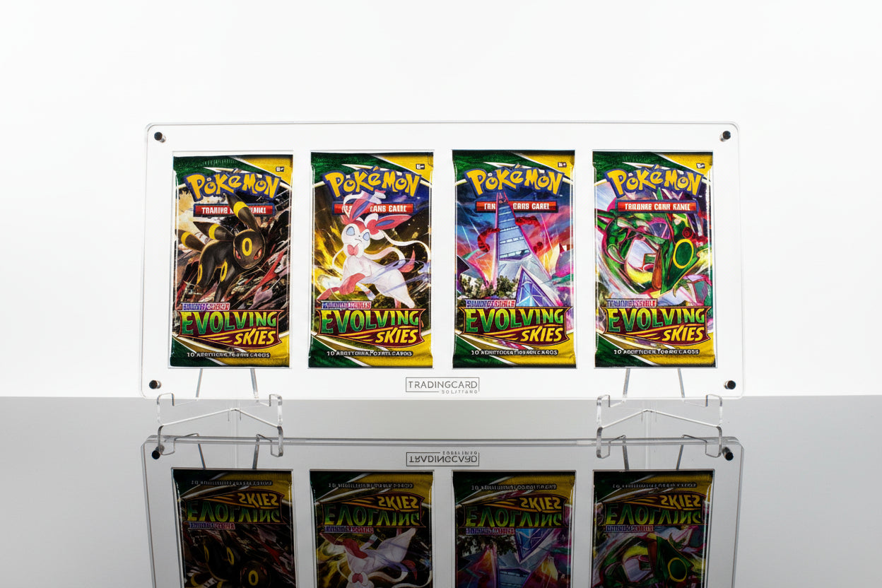 Four Pokemon trading card packs from the 'Evolving Skies' series on a display stand.